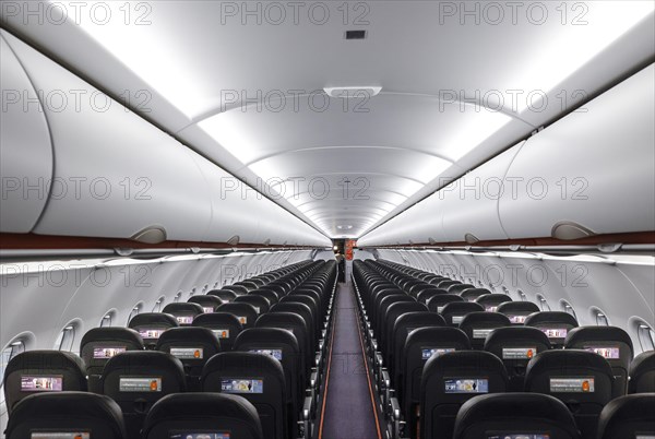View into an empty aircraft compartment of an easyJet Airbus A320 neo in the newly opened easyJet