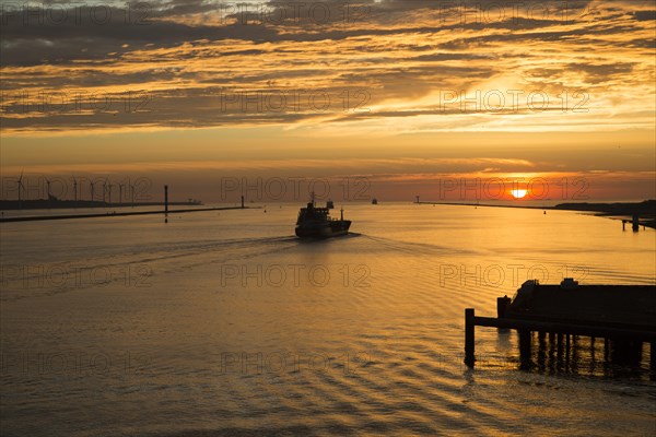 Sunset orange glow landscape clouds water, North Sea shipping, Port of Rotterdam, Hook of Holland,