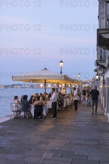 Restaurant on the waterfront of the Guidecca Canal, Dorsoduro district, Venice, Veneto, Italy,