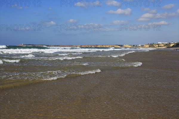 Waves breaking on sandy beach at Conil de la Frontera, Cadiz Province, Spain, Europe