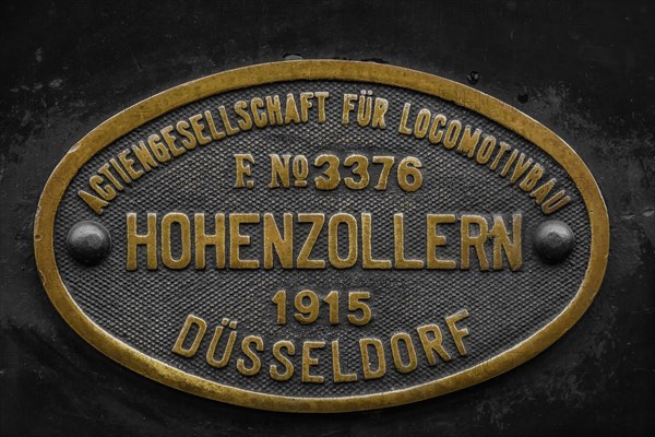 Brass factory plate of the 'Actiengesellschaft fuer Locomotivbau Hohenzollern' from 1915,