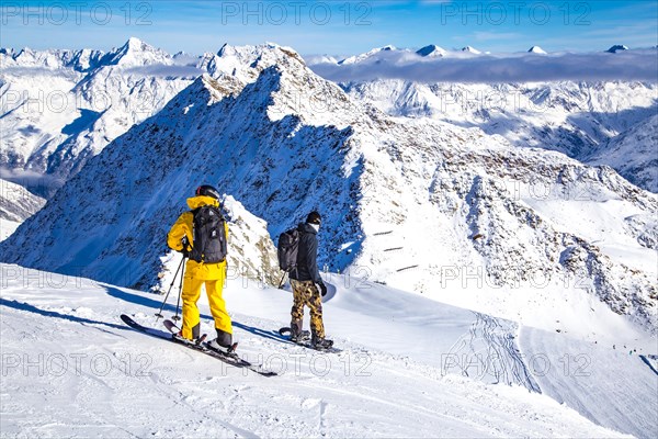 Skiers and snowboarders on the black ski route no. 41 from the Schwarze Schneid to the