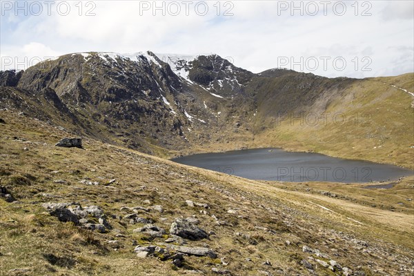 Striding Edge arete Helvellyn mountain peak and Red Tarn corrie lake, Lake District, Cumbria,