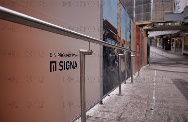 Construction site, controversial building project of Rene Benko's insolvent company Signa, logo,