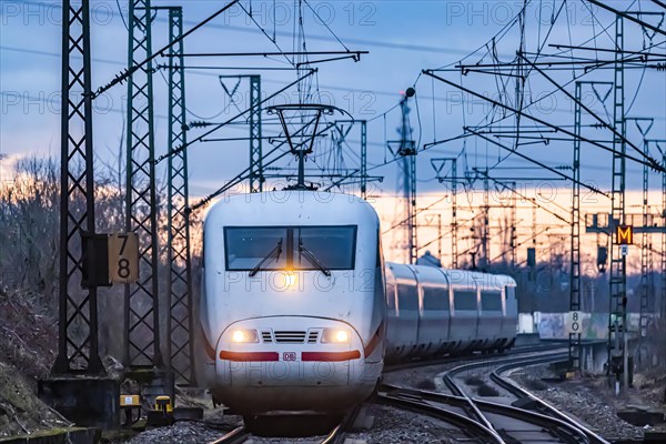 Railway line with many overhead lines and railway signals, InterCityExpress ICE of Deutsche Bahn