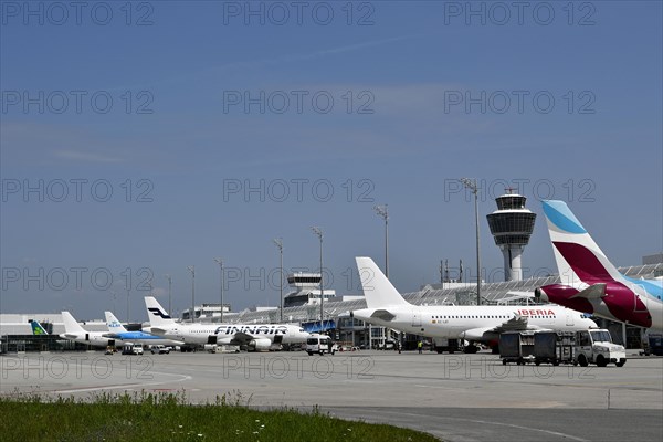 Overview Eurowings, Iberia, Finnair, KLM and Air Lingus aircraft at check-in position at Terminal 1