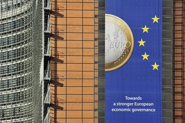 Banner about the euro hanging from the Berlaymont building of the European Commission, executive