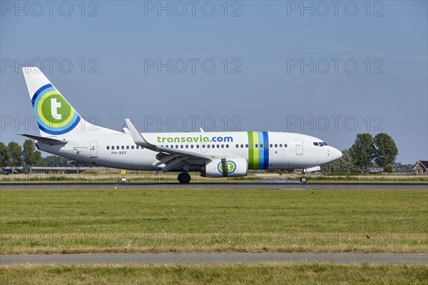 Transavia Boeing 737-7K2 with registration PH-XRY lands on the Polderbaan, Amsterdam Schiphol