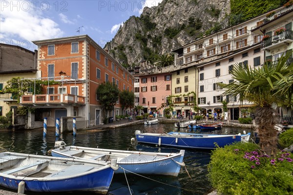 Houses and fishing boats in the old harbour of Limone sul Garda, Lake Garda, Province of Brescia,