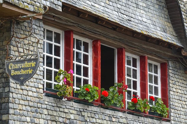 Rue du General de Gaulle in the old town centre of Le Faou with slate-roofed granite houses from