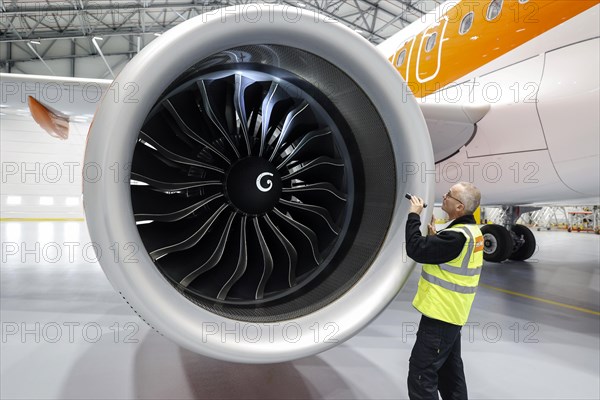 Olaf Gross, Licence Engineer at easyJet, checks the engine of an Airbus A320 Neo in front of the
