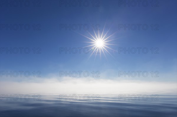Midnight sun over the Arctic Ocean, north of the Arctic Circle at Nordaustlandet, Svalbard,