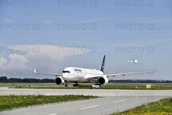 Lufthansa Airbus A350-900 after landing on taxiway from Runway North to Terminal 2, Munich Airport,