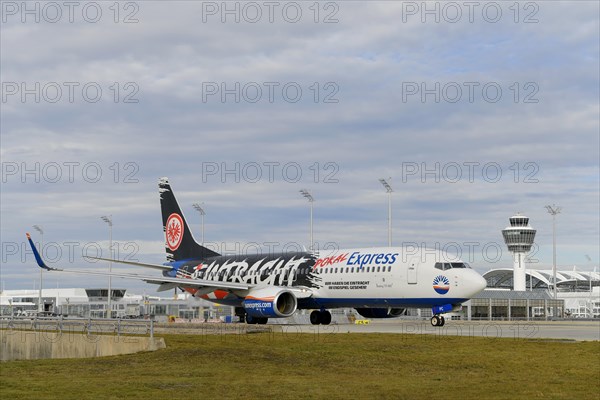 SunExpress with control tower taxiing from Terminal 1 onto Runway South, Munich Airport, Upper