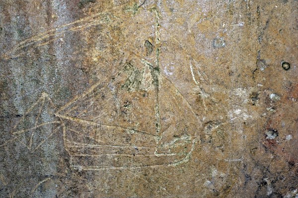 Old graffiti of galleon sailing ship carved on rampart wall of the citadel at Brouage,