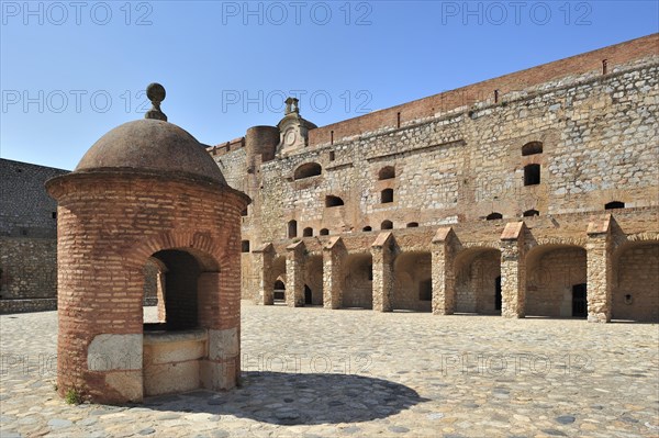 Inner court and well of the Catalan fortress Fort de Salses at Salses-le-Chateau, Pyrenees, France,