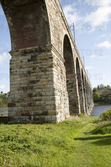 Stone arches of railway viaduct crossing River Tweed, Berwick-upon-Tweed, Northumberland, England,