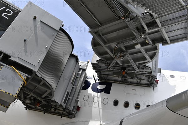 Lufthansa Airbus A380-800 with docked passenger boarding bridges at check-in position, Munich