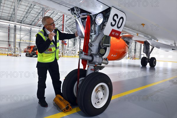 Olaf Gross, Licence Engineer at easyJet, checks the landing gear of an Airbus A320 Neo in front of