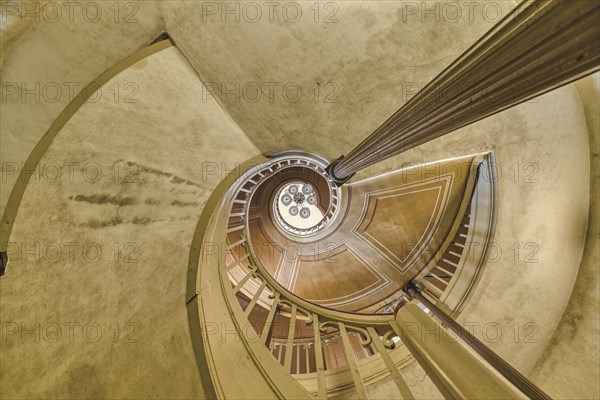 A detailed view of a spiral staircase with a spiral banister in beige tones, Schachtrupp Villa,