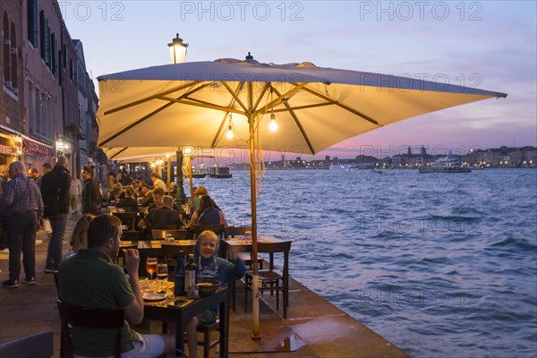 Restaurant on the waterfront of the Guidecca Canal, Dorsoduro district, Venice, Veneto, Italy,