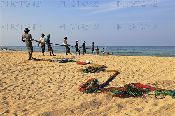 Traditional fishing hauling nets Nilavelli beach, near Trincomalee, Eastern province, Sri Lanka,