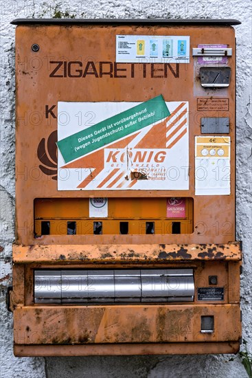 Rotten, rusty cigarette vending machine, device temporarily out of service due to youth protection,