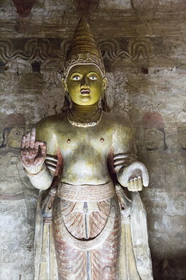 Buddha figure inside Dambulla cave Buddhist temple complex, Sri Lanka, Asia
