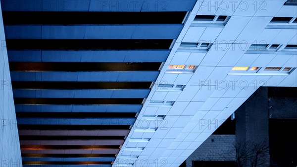 Illuminated rooms in a tower block in Gropiusstadt. The rise in rents in German cities has