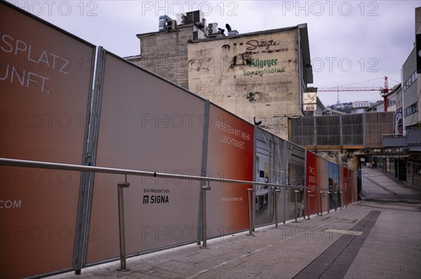 Construction site, controversial building project of Rene Benko's insolvent company Signa, logo,