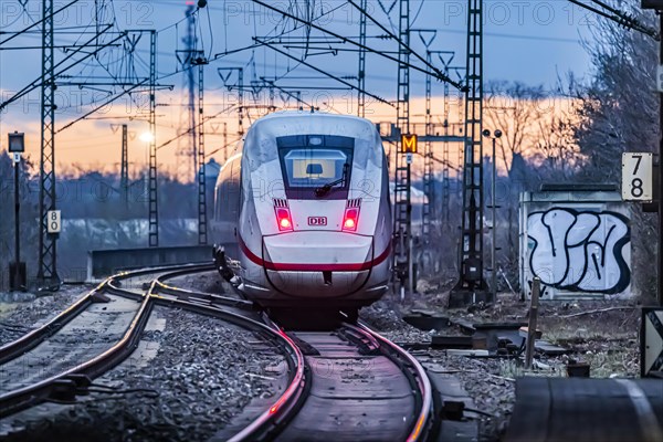 Railway line with many overhead lines and railway signals, InterCityExpress ICE of Deutsche Bahn