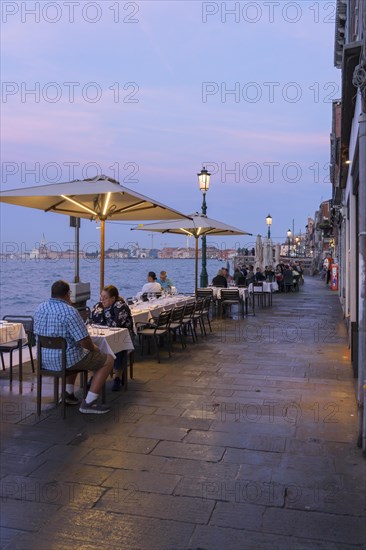 Restaurant on the waterfront of the Guidecca Canal, Dorsoduro district, Venice, Veneto, Italy,