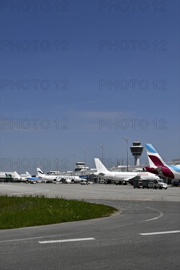 Overview Eurowings, Iberia, Finnair, KLM and Air Lingus aircraft at check-in position at Terminal 1