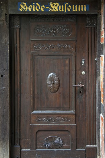 Old wooden door of the Heidemuseum, Rischmannshof Heath Museum, open air museum at Walsrode,