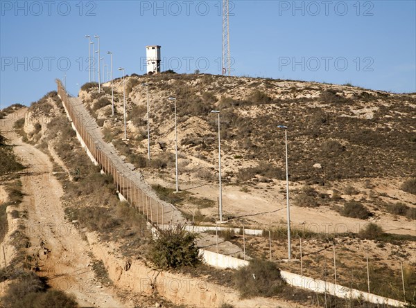 Security fence and look-out tower of military base in Melilla autonomous city state Spanish