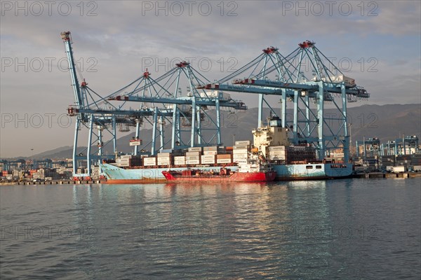 Large cranes at APM Terminals loading container ships port at Algeciras, Cadiz Province, Spain,