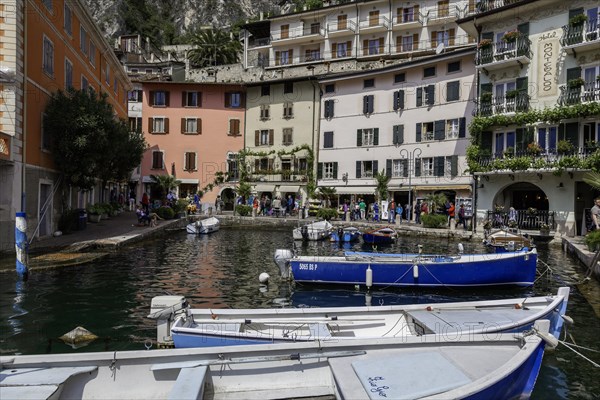 Houses and fishing boats in the old harbour of Limone sul Garda, Lake Garda, Province of Brescia,