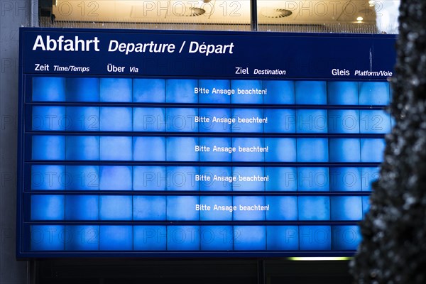 A large display board at Berlin Central Station reads Please note the announcement! Today is the