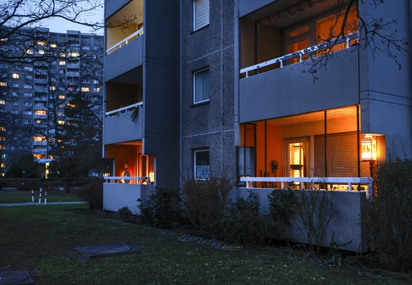 Illuminated balconies on a tower block in Gropiusstadt. The rise in rents in German cities