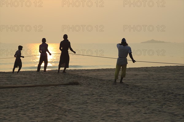 Traditional fishing hauling nets Nilavelli beach, near Trincomalee, Eastern province, Sri Lanka,