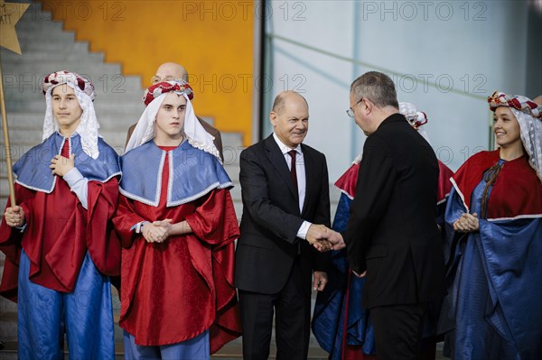 Federal Chancellor Olaf Scholz (SPD) pictured at the traditional reception for carol singers at the