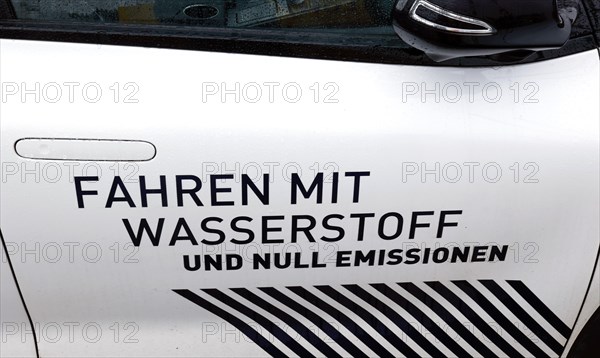 Hydrogen slogan Driving with hydrogen and zero emissions on a hydrogen-powered vehicle, Berlin, 11