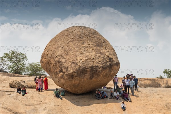 Indian tourists, Krishna's butterball, natural boulder, UNESCO World Heritage Site, Mahabalipuram