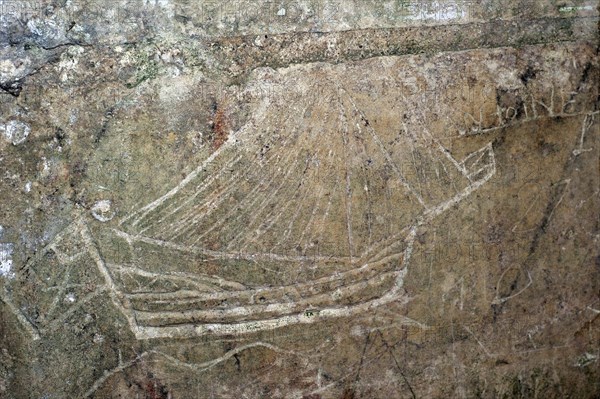 Old graffiti of galleon sailing ship carved on rampart wall of the citadel at Brouage,