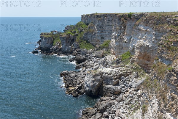 Picturesque cliffs with eroded rock formations on the edge of the sapphire blue sea, cliffs, Kamen