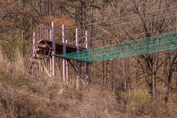 Fire brigade training tower and attached safety net used to practice balance located in