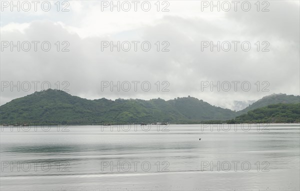 Lombok and Gili Air islands, overcast, cloudy day, sky and sea. Vacation, travel, tropics concept,