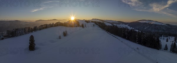 Sunset over the second Jura chain in winter, foreground contours of sinkholes, view towards the