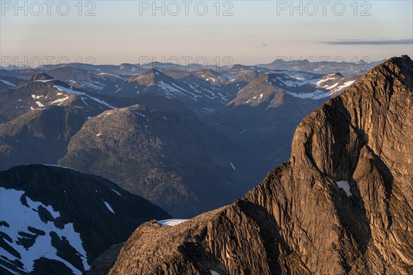 Mountain peak in soft evening light, view from the summit of Skala at sunset, Loen, Norway, Europe