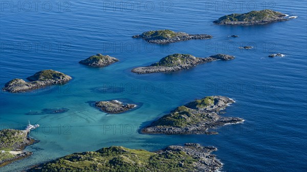 Coast and rocky islands in the blue sea, sea with archipelago islands, Ulvagsundet, Vesteralen,